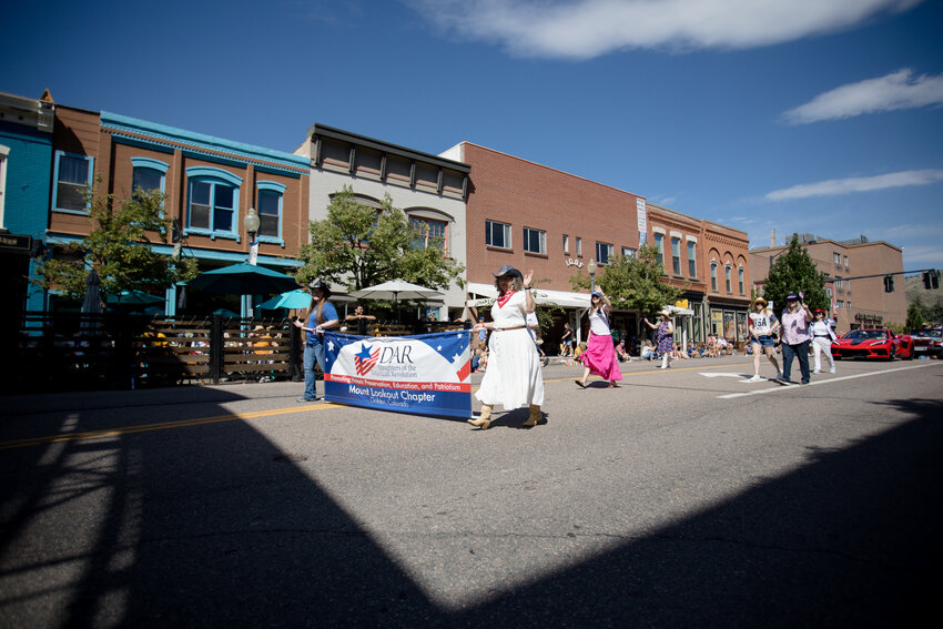 The Daughters of the American Revolution march in the Buffalo Bill Days parade Saturday morning.